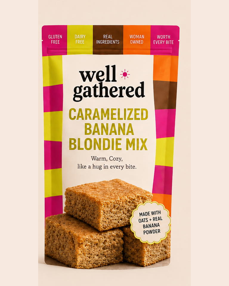Well Gathered Caramelized Banana Blondie Mix stand-up pouch with a pink, orange, and olive checkered border, showing a stack of blondies